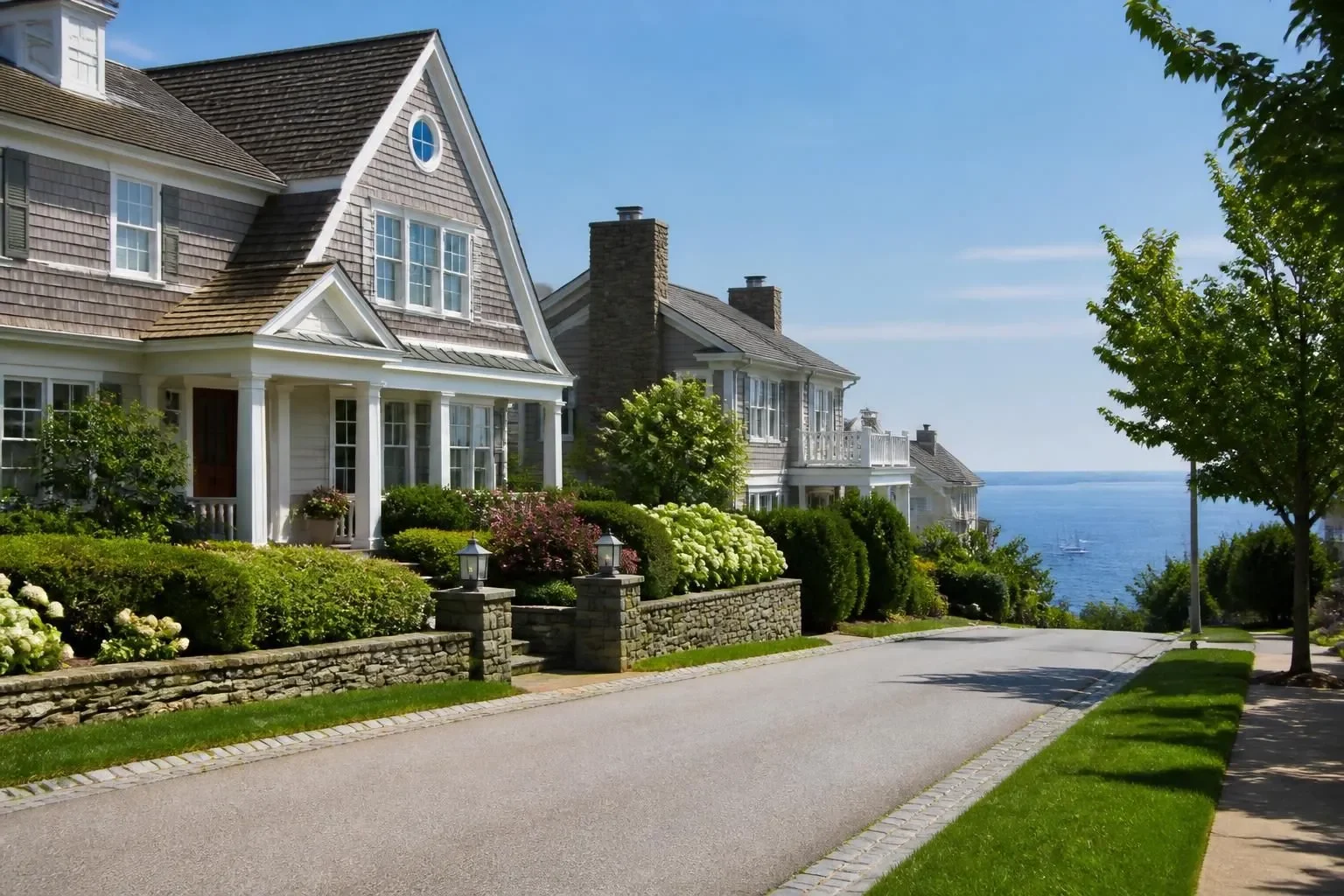 Shingle-style homes on a street by the ocean in Coronado
